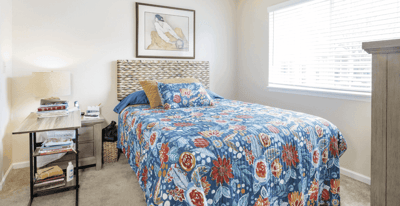 Cozy private resident room with floral bedding