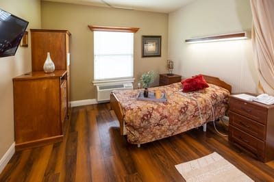 Cozy private resident room with wooden furniture