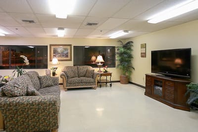 Comfortable common area with seating and television