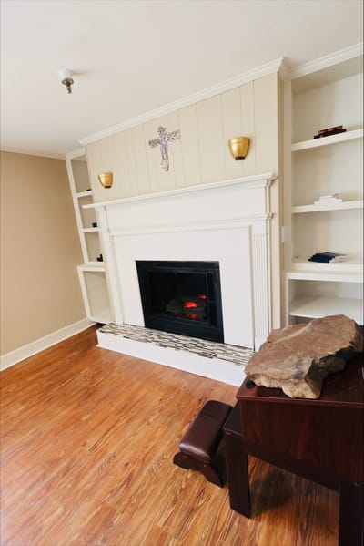 Cozy interior space with a fireplace and shelves