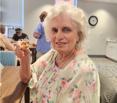 A resident enjoying a snack in a common area