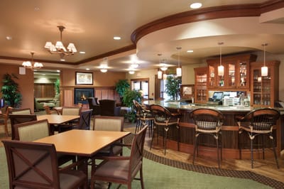 Bright common area with seating and bar