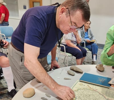 Staff member assisting residents in an activity center