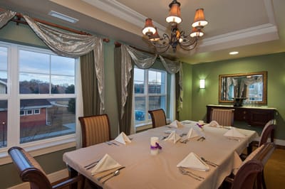 Dining area with set tables and elegant lighting