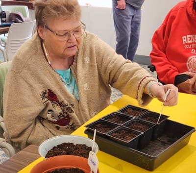 Resident engaging in a gardening activity indoors