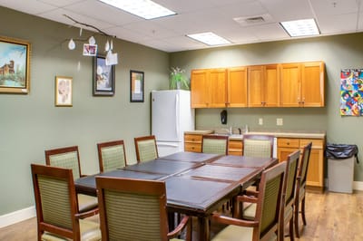 A community meeting room with a large table and chairs