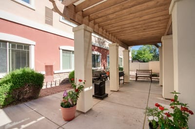 Outdoor patio area with plants and seating