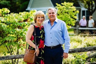 A couple posing in a garden setting at the facility