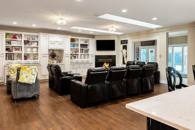 Interior common area with seating and a fireplace