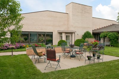 Outdoor seating area with tables and flowers