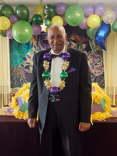 Resident enjoying a festive event with decorations