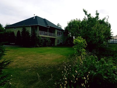 Exterior view of a nursing home with greenery