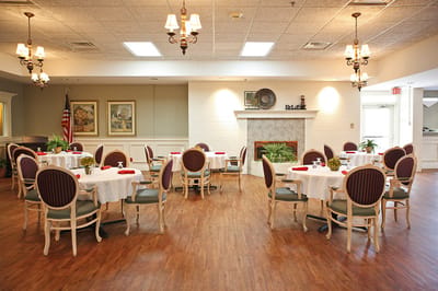 Dining room setup with tables and chairs