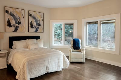 Cozy private resident room with bed and windows