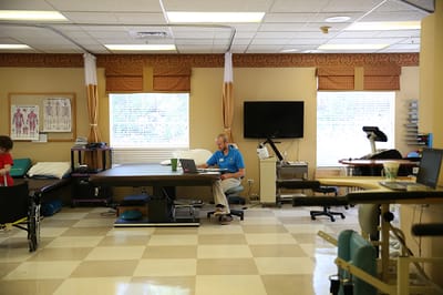 Therapist working in a rehabilitation room