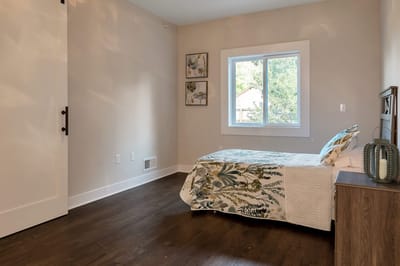 Cozy resident room with a bed and window