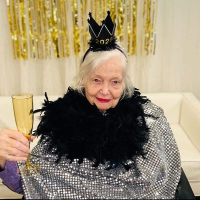 Resident celebrating New Year's Eve with a drink
