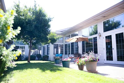 Outdoor area of the facility with seating and greenery