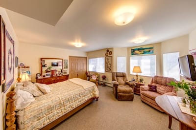 Cozy resident room with a bed and seating area