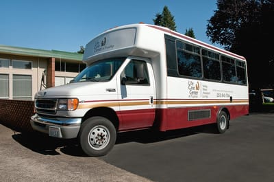 Facility transport van parked outside the building