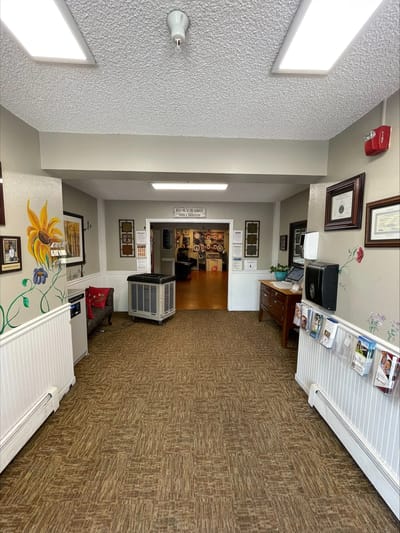 A hallway in a senior living facility with decorations