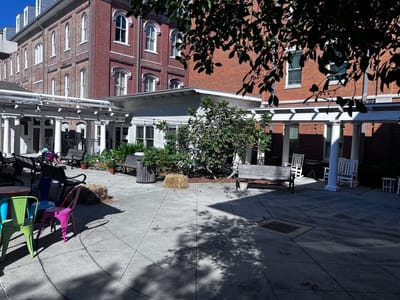 Outdoor courtyard area with benches and greenery
