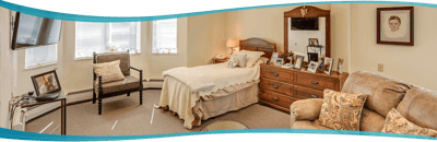 Cozy resident room with bed and seating area