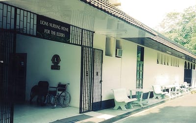 Exterior view of Lions Nursing Home with wheelchair