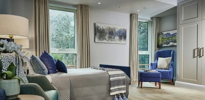 Bright, modern resident room with comfortable furnishings