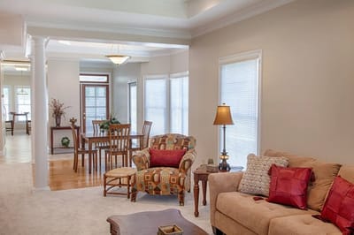 Bright common area with seating and dining space