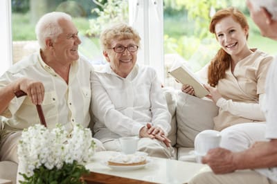 Residents and staff enjoying time together in a common area