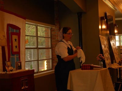 Staff member engaging with residents in an interior space