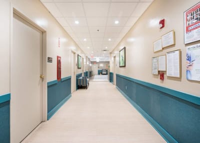 Well-lit hallway in a senior care facility