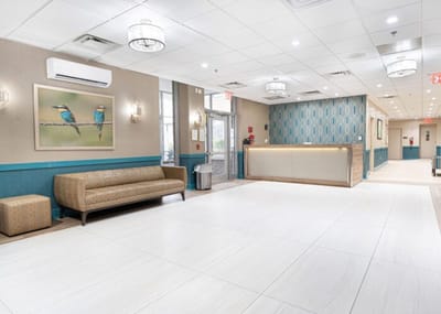 Bright and spacious facility lobby with a sofa