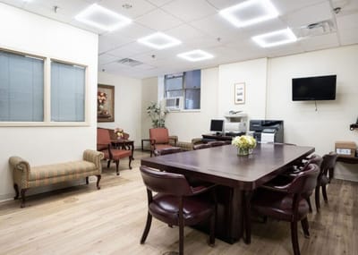 Interior view of a common area with seating and a table