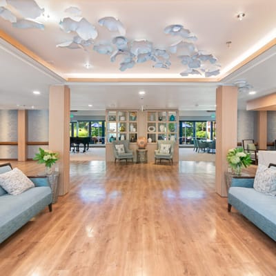 Bright common area with blue decor and seating