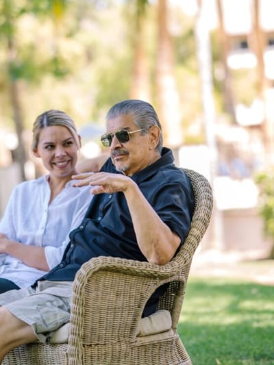 Residents enjoying conversation in a garden setting