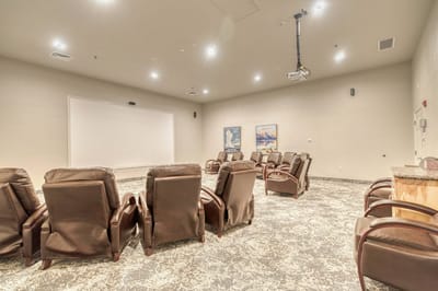 Interior view of a shared social space with recliners