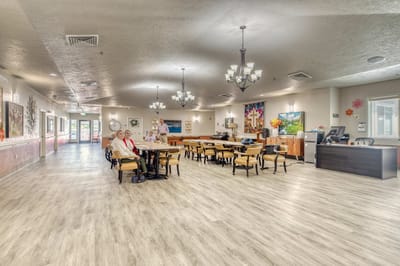 Bright interior dining room with residents and staff