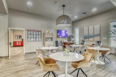 Bright common area with tables and chairs