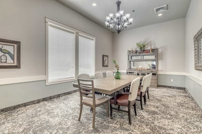 Bright common area with dining table and decor