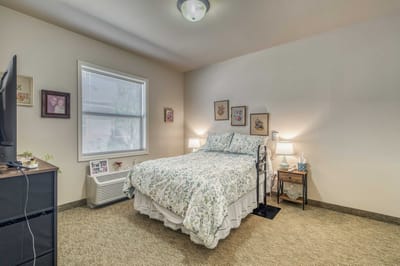 Cozy private resident room with floral bedding