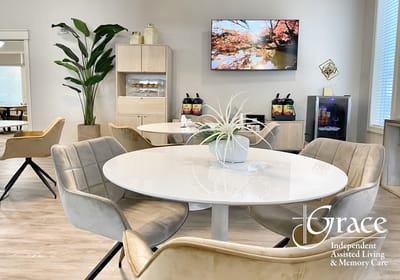 Bright common area with seating and nature view