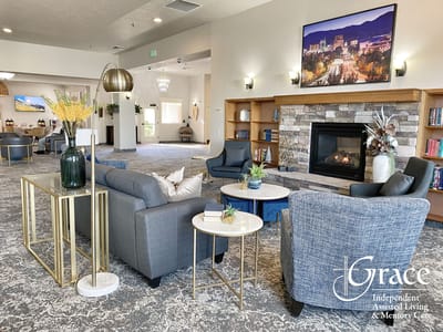 Comfortable lounge area with fireplace in assisted living facility