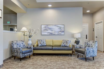 Cozy lobby seating area with floral decor