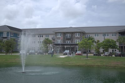 Exterior view of The Landings at Gentry Park with water feature