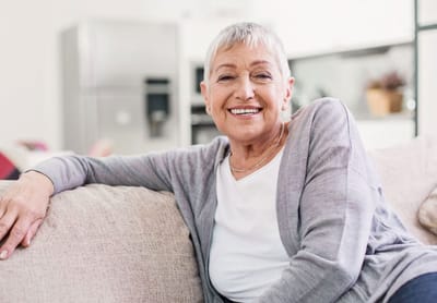 Atlantic Shores, Nursing Home in Virginia Beach, VA — Smiling senior woman relaxing on a couch
