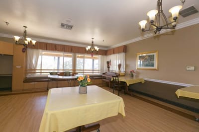 Bright common area with tables and chairs