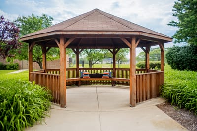 Outdoor gazebo surrounded by greenery