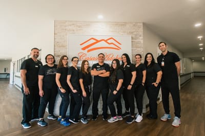 Staff members posing in the facility lobby